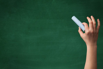 Hand writing on clean blackboard