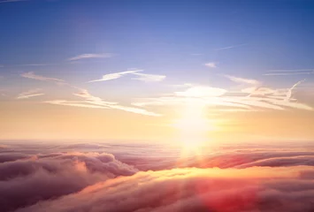 Wall murals Aerial photo Beautiful aerial view above clouds with sunset.