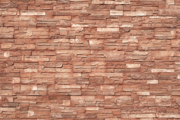 brownish texture of ceramic tiles glued to the outside of the building, bright color