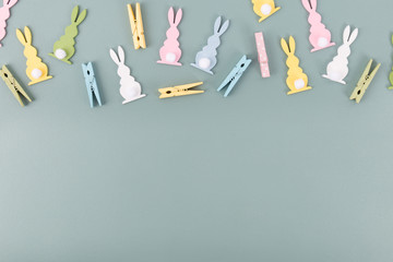 Colorful pins and bunnies on gray