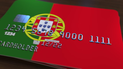 Plastic bank card featuring flag of Portugal. National banking system related 3D rendering