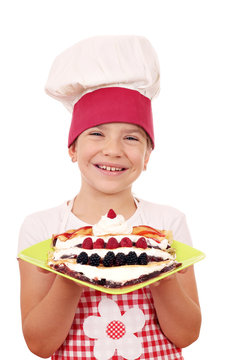 happy little girl cook with sweet crepes dessert