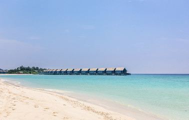 Blue lagoon and tropical island in Maldives