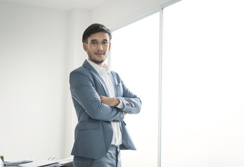 Fototapeta premium Portrait young businessman handsome looking for something.