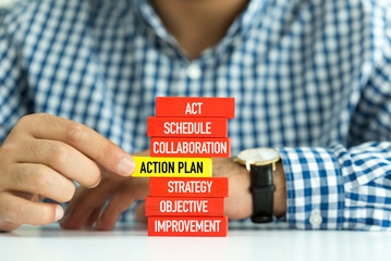 Businessman Building ACTIONPLAN Concept with Wooden Blocks