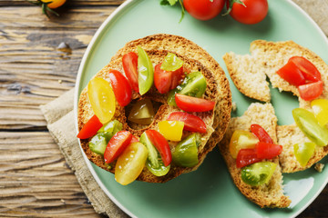 Traditional italian bread frisella with tomatos