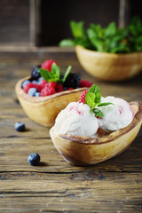 Fresh fruit ice cream with mint on the wooden background