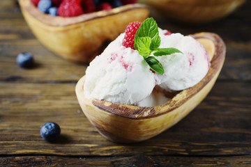 Fresh fruit ice cream with mint on the wooden background
