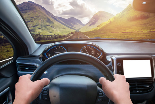 Car navigation display mockup. View from the driver's angle. Modern car interior.