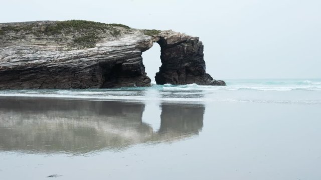 Beach of the Cathedrals. Natural arch at Las Catedrales beach known as Praia de Augas Santas (Beach of the Holy Waters) in Galicia, Spain