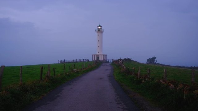 Faro de Lastres. Lastres lighthouse at twilight, Spain
