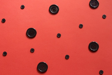 Black buttons polka dot on red paper background