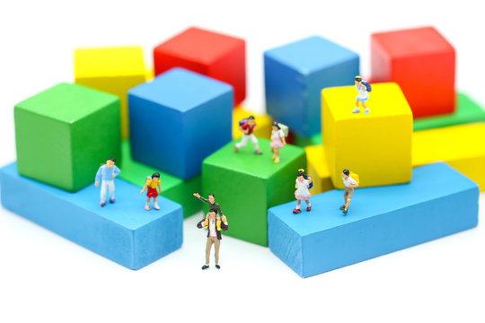 Miniature people : children and student  with colour wooden block,play and education concept.