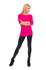 Fototapeta premium Smiling Woman With Arms Crossed Is Standing Legs Apart And Looking Away