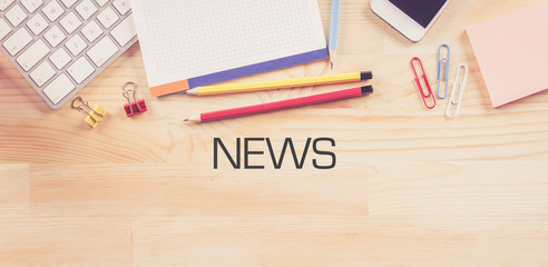 Business Workplace with  NEWS Concept on Wooden Background