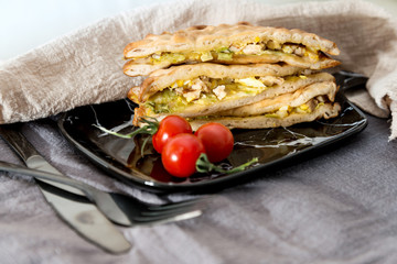 Sandwich with chicken, cheese and golden French fries potatoes