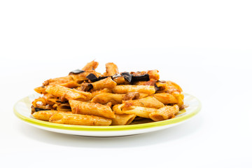 Spaghetti with aubergine and tomato sauce on a the table