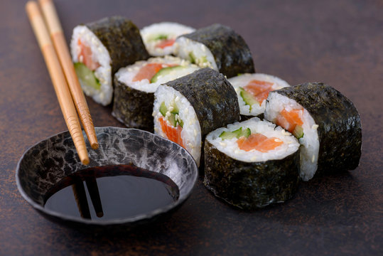Close-up sushi roll with soy sauce