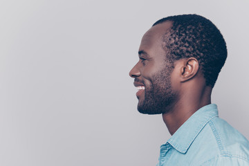Profile, side view portrait with copy space, empty place for product of virile, smiling, manly, positive, cheerful man isolated on grey background