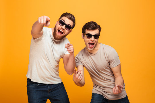 Portrait of a two cheerful young men in sunglasses