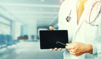 Medicine And Healthcare Concept. Doctor Using Digital Tablet In Consultation With Patient