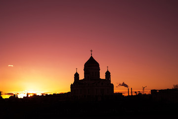 Fototapeta na wymiar Sunset over the Moscow River And Orthodox Cathedral of Christ the Saviour in Russia