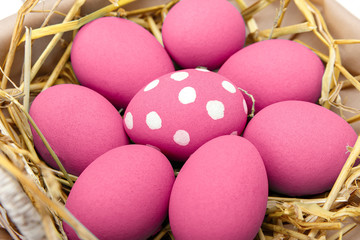 Pink Easter eggs on wodden background. Still life photo of lots of pink easter eggs. Copyspace.