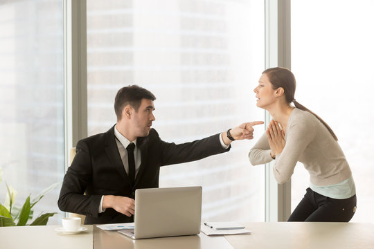 Wrathful company leader pointing guilty female employee on exit and asking to leave, scared of dismissal millennial woman begging angry boss not to fire her. Hiring manager refusing candidate in job