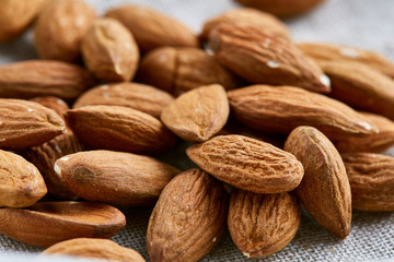 Raw almond food background, close-up, shallow depth of field, macro.