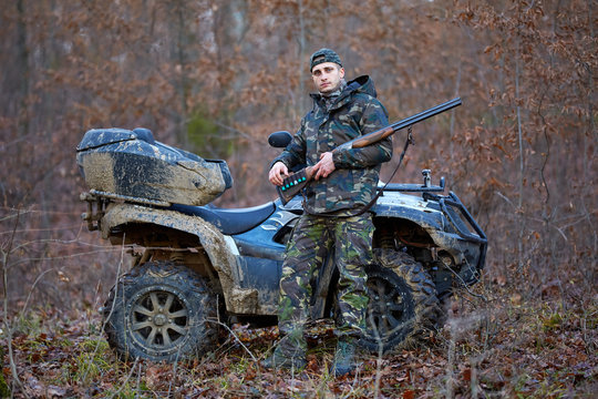 Hunter on ATV in the forest