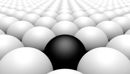 Black ball amongst white balls, concept of racism, 3d illustration