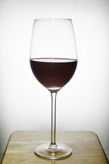 glass of wine on wood