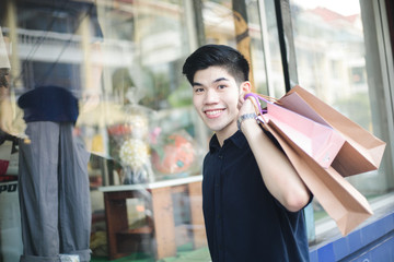 Young asian male shopping