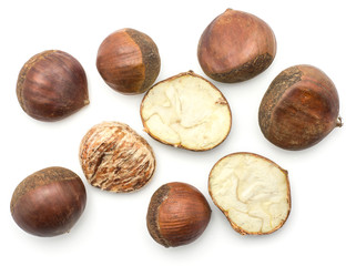 European chestnuts Spanish edible whole halved and peel isolated on white background raw fresh brown nuts top view.
