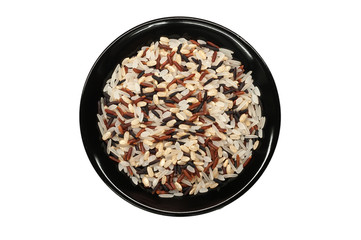 Rice in a black plate on a white background. Assorted multi-colored rice. Black, brown and white rice.
