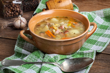 Pea soup with vegetables and bacon.