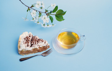 cake with tea on blue background