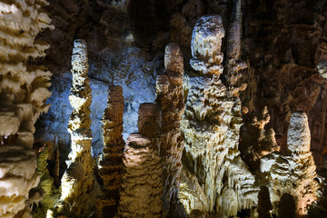 Beautiful view of stalactites and stalagmites in an underground cavern. Grotte di Frasassi, Italy