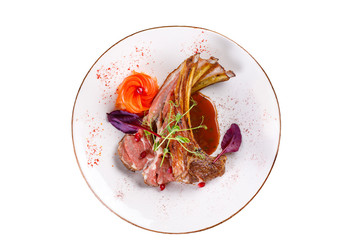 Juicy appetizing pork ribs on a white background.