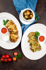 Draniki, potatoes with sauces, cherry tomatoes