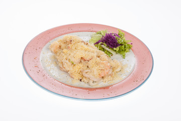 mediterranean food, dish of seafood stew covered with parmesan cheese