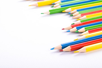  Colorful pencils pattern isolated on white background. Top view colorful of color pencils.Colored pencils, isolated on the white background. Color pencil with copy space isolated on white background,
