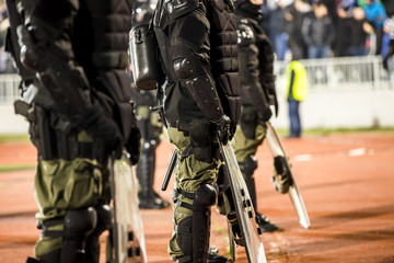The police at the stadium event secure a safe match against the hooligans