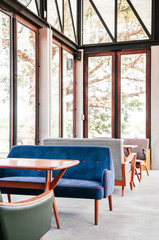 Beautiful retro furniture vintage armchair sofa interior with daylight - pastel color retro sofa couch