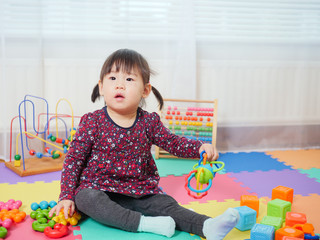 baby girl play toy at home