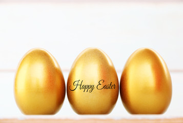 happy easter text and gold egg easter on background