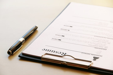 resume paper on businessman desk in Office Business