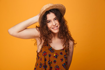 Cute young lady standing isolated over yellow background