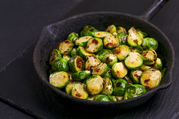 Vegetarian cuisine. Brussels Sprouts roasted with olive oil. Copyspace