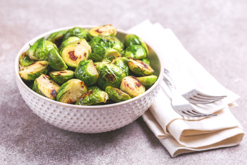 Vegetarian cuisine. Brussels Sprouts roasted with olive oil. Copyspace